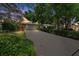 Charming single-story home with lush landscaping, long driveway, and an attached two-car garage at 838 Park Ct, Palm Harbor, FL 34683