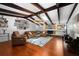 Spacious living room boasts wood floors, vaulted ceilings, and a stone fireplace at 838 Park Ct, Palm Harbor, FL 34683