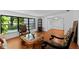 Sitting area boasts hardwood floors, chairs and a beautiful garden view at 838 Park Ct, Palm Harbor, FL 34683