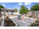 Serene backyard with a charming patio, perfect for outdoor dining and relaxation with shade trees and a hammock at 9414 Northcliffe Blvd, Spring Hill, FL 34606