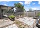 Spacious backyard featuring a screened-in patio, lush greenery, and a peaceful garden area at 9414 Northcliffe Blvd, Spring Hill, FL 34606