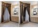 Cozy bathroom features a vanity with a mirror and a shower with a brown patterned curtain at 9414 Northcliffe Blvd, Spring Hill, FL 34606