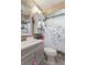 Bathroom featuring a sink, toilet and floral shower curtain at 9414 Northcliffe Blvd, Spring Hill, FL 34606