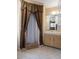 Cozy bathroom features a vanity with a mirror and a shower with a brown patterned curtain at 9414 Northcliffe Blvd, Spring Hill, FL 34606