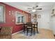 Dining room with a wood table, four chairs, and an opening to another room, creating an open feel at 9414 Northcliffe Blvd, Spring Hill, FL 34606