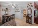 Open dining area with tile floors, display cabinet, and access to the stainless steel kitchen at 9414 Northcliffe Blvd, Spring Hill, FL 34606