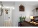 Hallway to the bedrooms featuring neutral walls, tile floor and two storage closets at 9414 Northcliffe Blvd, Spring Hill, FL 34606