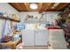 Bright laundry area featuring a side by side washer and dryer and ample storage space at 9414 Northcliffe Blvd, Spring Hill, FL 34606