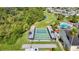Beautiful aerial view featuring shuffleboard courts, golf course and a pool showcasing the diverse recreational amenities in this community at 9608 Rolling Cir, San Antonio, FL 33576