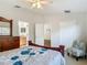 Comfortable bedroom with a ceiling fan, closet, and an ensuite bathroom access at 9608 Rolling Cir, San Antonio, FL 33576