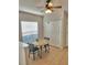 Cozy dining area near a closet and a window with blinds at 9608 Rolling Cir, San Antonio, FL 33576