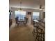Bright dining area featuring a round table with seating, a ceiling fan, and a convenient breakfast bar nearby at 9608 Rolling Cir, San Antonio, FL 33576