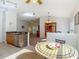 Open-concept kitchen with stainless steel appliances, granite counters, and views of the living area at 9608 Rolling Cir, San Antonio, FL 33576
