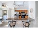 Eat-in kitchen with stainless steel appliances and granite counters offering a perfect blend of style at 9608 Rolling Cir, San Antonio, FL 33576
