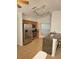 Well-equipped kitchen with stainless steel appliances, wooden cabinets, granite countertops, and a track lighting system at 9608 Rolling Cir, San Antonio, FL 33576