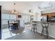 Bright and airy living room with an open floor plan, modern fixtures, and natural light at 9608 Rolling Cir, San Antonio, FL 33576