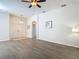 Spacious living room with wood flooring and neutral color scheme, ideal for Gathering gatherings at 9608 Rolling Cir, San Antonio, FL 33576