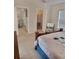This main bedroom shows a closet, a comfortable chair and a view into another room at 9608 Rolling Cir, San Antonio, FL 33576