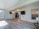 Bright sunroom featuring durable flooring, a ceiling fan, and multiple windows at 9608 Rolling Cir, San Antonio, FL 33576
