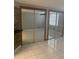 Bedroom with mirrored closet doors, tile flooring and a ceiling fan for comfort at 10106 Wheatley Hills Ct, Tampa, FL 33615