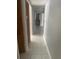 Hallway featuring tile flooring that leads to the various rooms of the house at 10106 Wheatley Hills Ct, Tampa, FL 33615