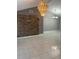 Spacious living area featuring a stone accent wall, tile flooring and vaulted ceilings at 10106 Wheatley Hills Ct, Tampa, FL 33615