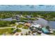 Aerial view showcasing waterfront home with a terracotta roof and dock at 105 6Th Nw St, Ruskin, FL 33570