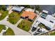 Aerial view of a single Gathering home with a terracotta roof and a dock at 105 6Th Nw St, Ruskin, FL 33570