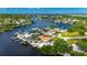 Aerial view of waterfront home featuring a terracotta roof and dock at 105 6Th Nw St, Ruskin, FL 33570