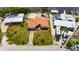 Aerial view of a single Gathering home with a terracotta roof and outlined property at 105 6Th Nw St, Ruskin, FL 33570