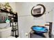 Bathroom featuring vessel sink, shelving and mirror at 105 6Th Nw St, Ruskin, FL 33570