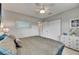Cozy bedroom features a large bed, leaf-design ceiling fan and double door closet at 105 6Th Nw St, Ruskin, FL 33570