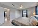 Bedroom featuring overhead fan, neutral walls and access to hallway at 105 6Th Nw St, Ruskin, FL 33570