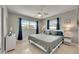 Calm bedroom with a leaf-design ceiling fan, matching side tables and three window view at 105 6Th Nw St, Ruskin, FL 33570