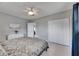 Bedroom featuring double closet doors, overhead fan and art at 105 6Th Nw St, Ruskin, FL 33570