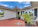 Charming front porch with seating, potted plants, and a decorative star design at 105 6Th Nw St, Ruskin, FL 33570