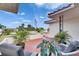 Inviting front porch with seating, potted plants, a decorative star design, and street view at 105 6Th Nw St, Ruskin, FL 33570