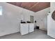 View of garage featuring hot water tank, washer and dryer at 105 6Th Nw St, Ruskin, FL 33570