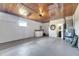 View of garage featuring washer, dryer, hot water tank and entrance to bathroom at 105 6Th Nw St, Ruskin, FL 33570