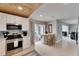 Bright kitchen featuring stainless steel appliances, a breakfast bar, and access to an outdoor patio at 105 6Th Nw St, Ruskin, FL 33570