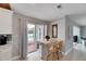 Bright kitchen featuring a breakfast bar that leads to a screened in lanai at 105 6Th Nw St, Ruskin, FL 33570