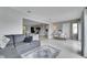 Inviting living room with open floorplan, Terrazzo floors, and comfortable seating at 105 6Th Nw St, Ruskin, FL 33570