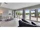 Open living area with Terrazzo floors, dining space and water views at 105 6Th Nw St, Ruskin, FL 33570