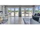 Bright living room with Terrazzo floors, water views, and comfortable sofa at 105 6Th Nw St, Ruskin, FL 33570