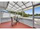 View of screen porch with seating overlooking the water at 105 6Th Nw St, Ruskin, FL 33570