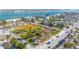 Bird's-eye view of community amenities, including a park with sports fields and lush landscaping by the waterfront at 108 14Th Ave # 2, St Pete Beach, FL 33706