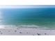 Scenic aerial view of the beach with clear blue water and sandy shoreline at 108 14Th Ave # 2, St Pete Beach, FL 33706