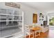 Bright dining area with a view of the community, and a view into the living room at 108 14Th Ave # 2, St Pete Beach, FL 33706