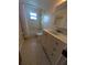 Bathroom featuring a vanity, shower-tub combo, and tile floors at 10968 105Th Ave, Largo, FL 33778