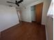 This bedroom features hardwood floors, a ceiling fan, a closet, and bright natural light at 10968 105Th Ave, Largo, FL 33778